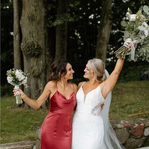 Drape neckline with low back, fit-to-flare dress with slit in fluid satin.